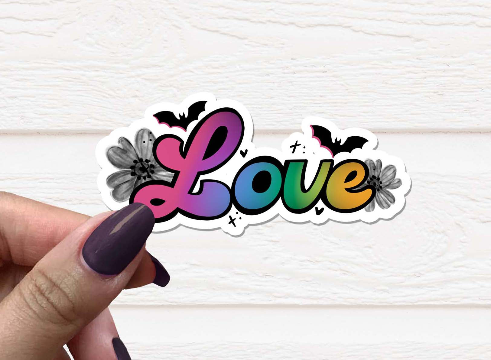 A Gothic Love Vinyl Sticker featuring intricate gothic designs, perfect for personalizing various items.