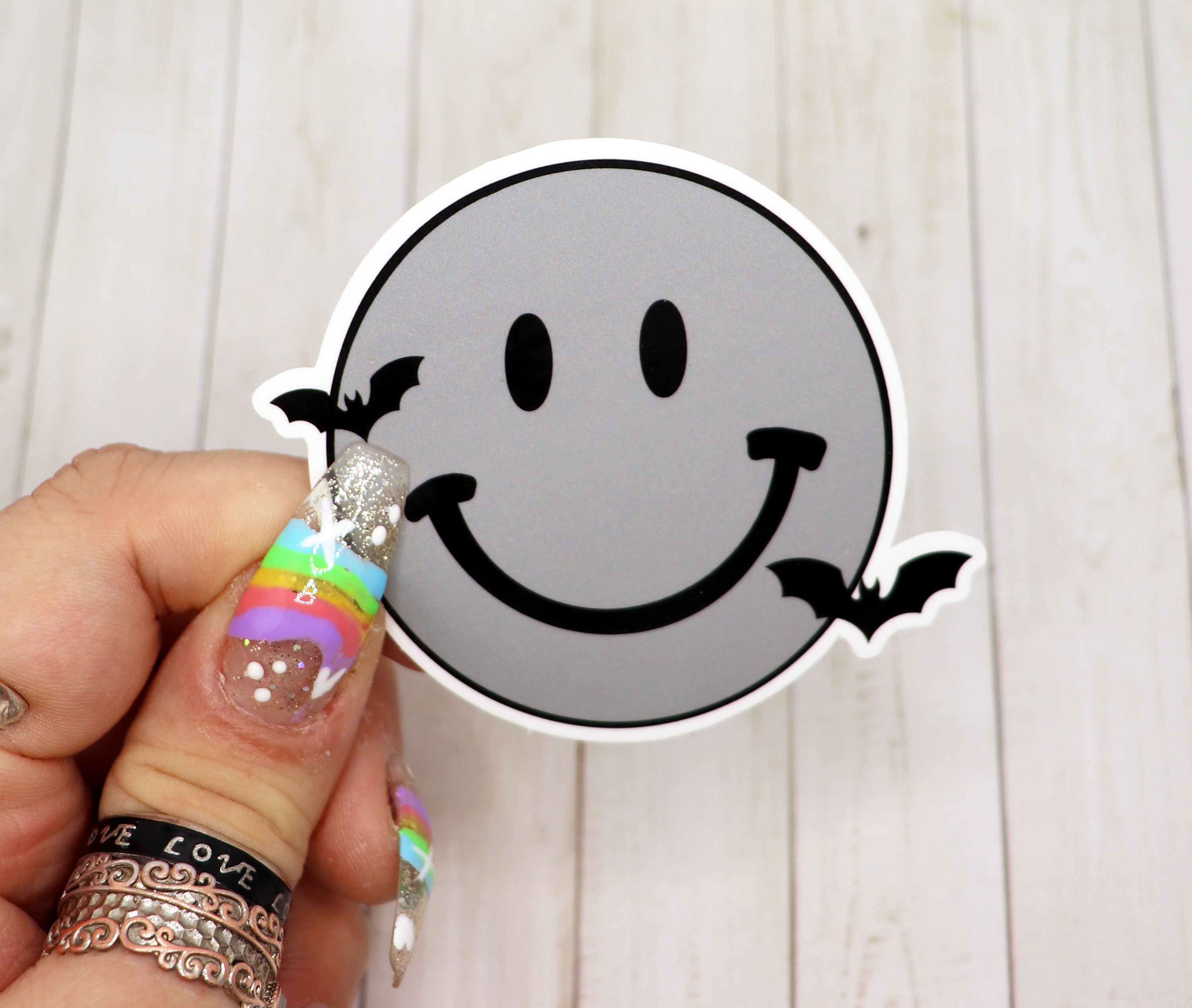 Gothic Smiley Face Vinyl Sticker on a white background, showcasing its unique design and matte finish.