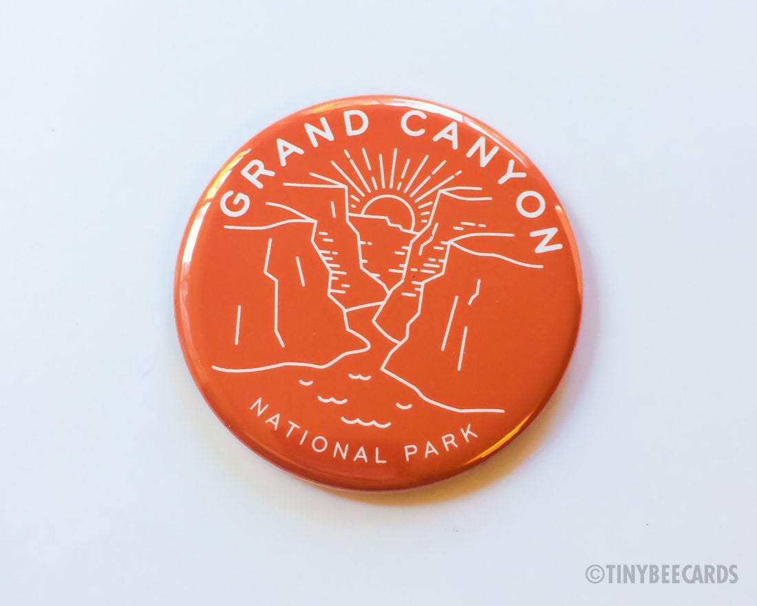 A vibrant 2.25-inch round magnet featuring the Grand Canyon scenery with text 'Grand Canyon National Park', perfect for gifts.