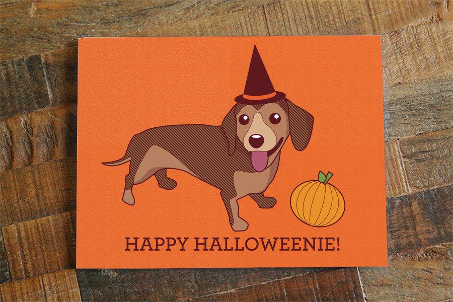 A humorous Halloween card featuring a Dachshund with the text 'Happy Halloweenie', designed for dog lovers.