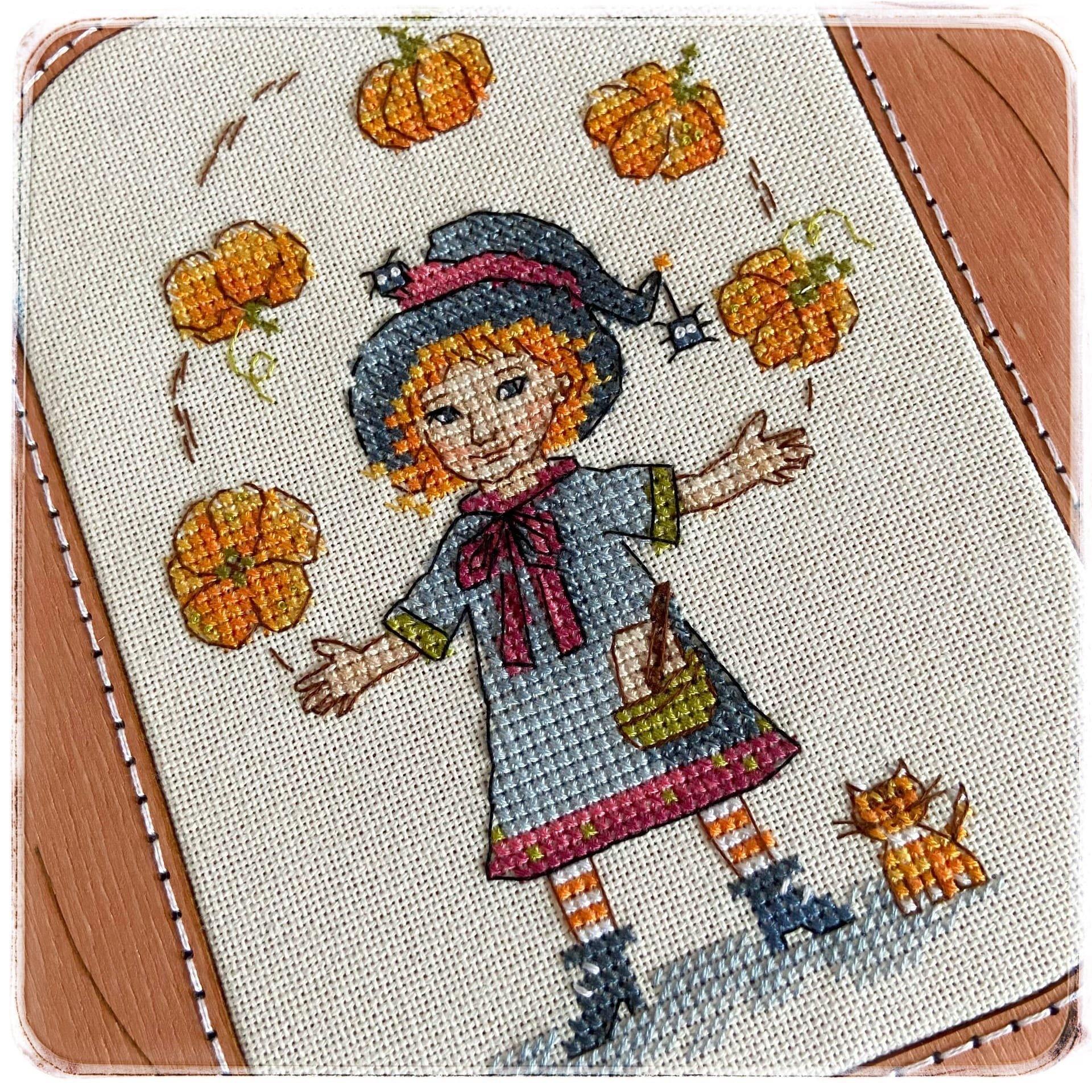 Harvest Festival SP-08 Counted Cross-Stitch Kit featuring a witch girl and pumpkins, showcasing quality materials and design.