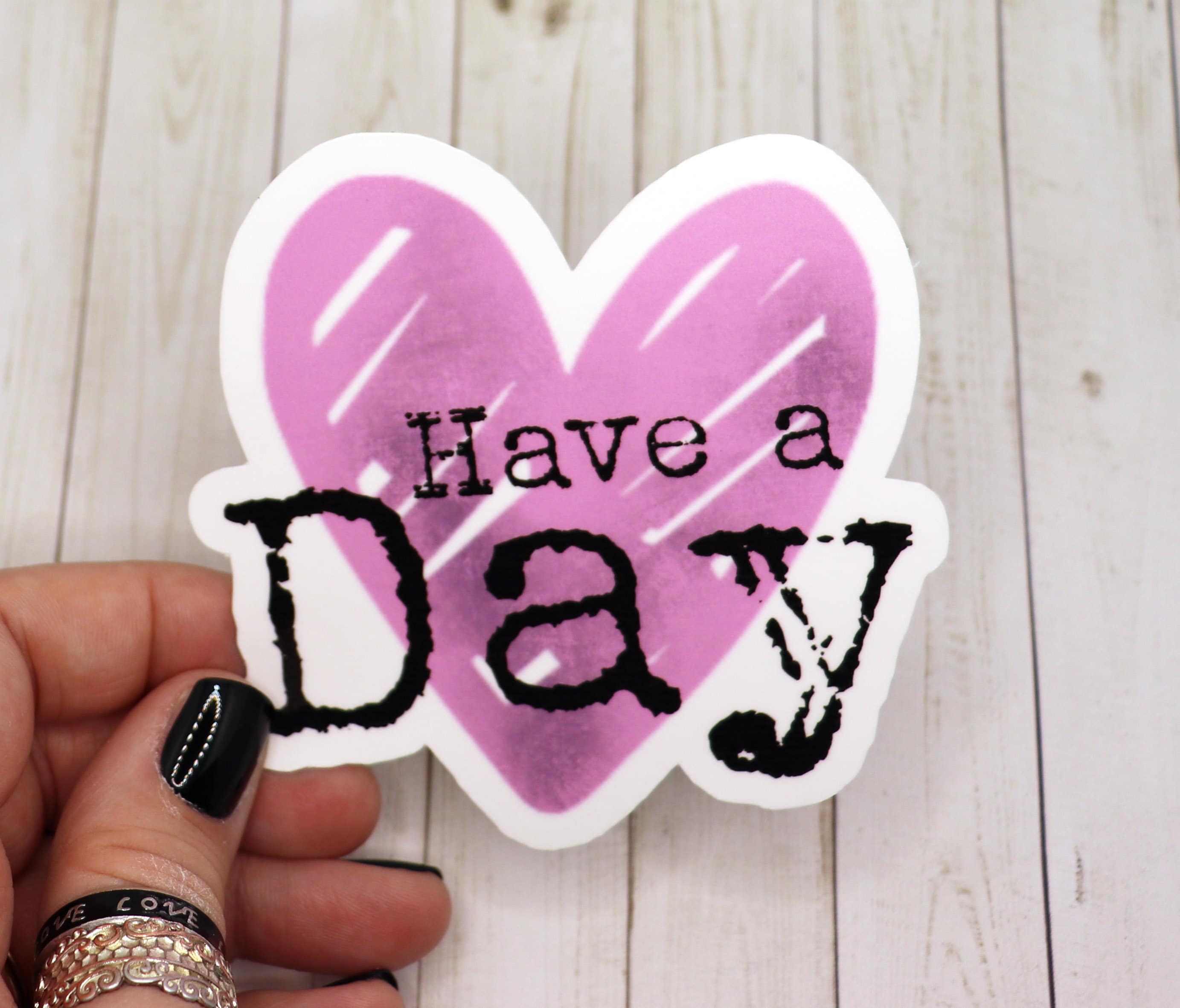 Have a Day vinyl sticker featuring a cheerful design, measuring 2.5 inches, perfect for personalizing various items.