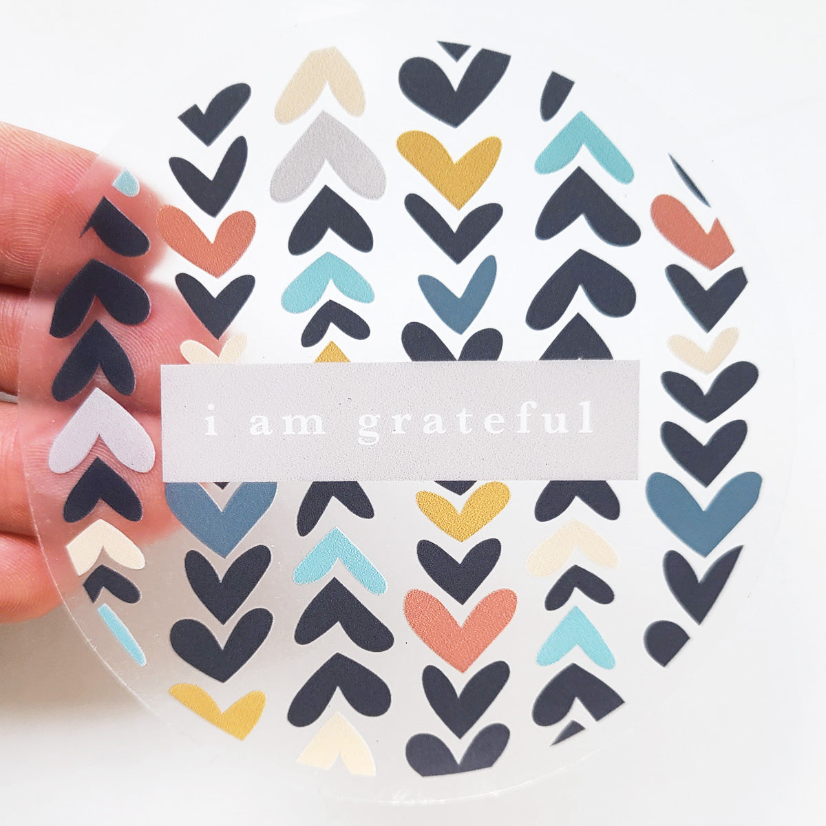 Heartwood 3-inch clear gratitude sticker featuring a simple design that promotes positivity and appreciation.