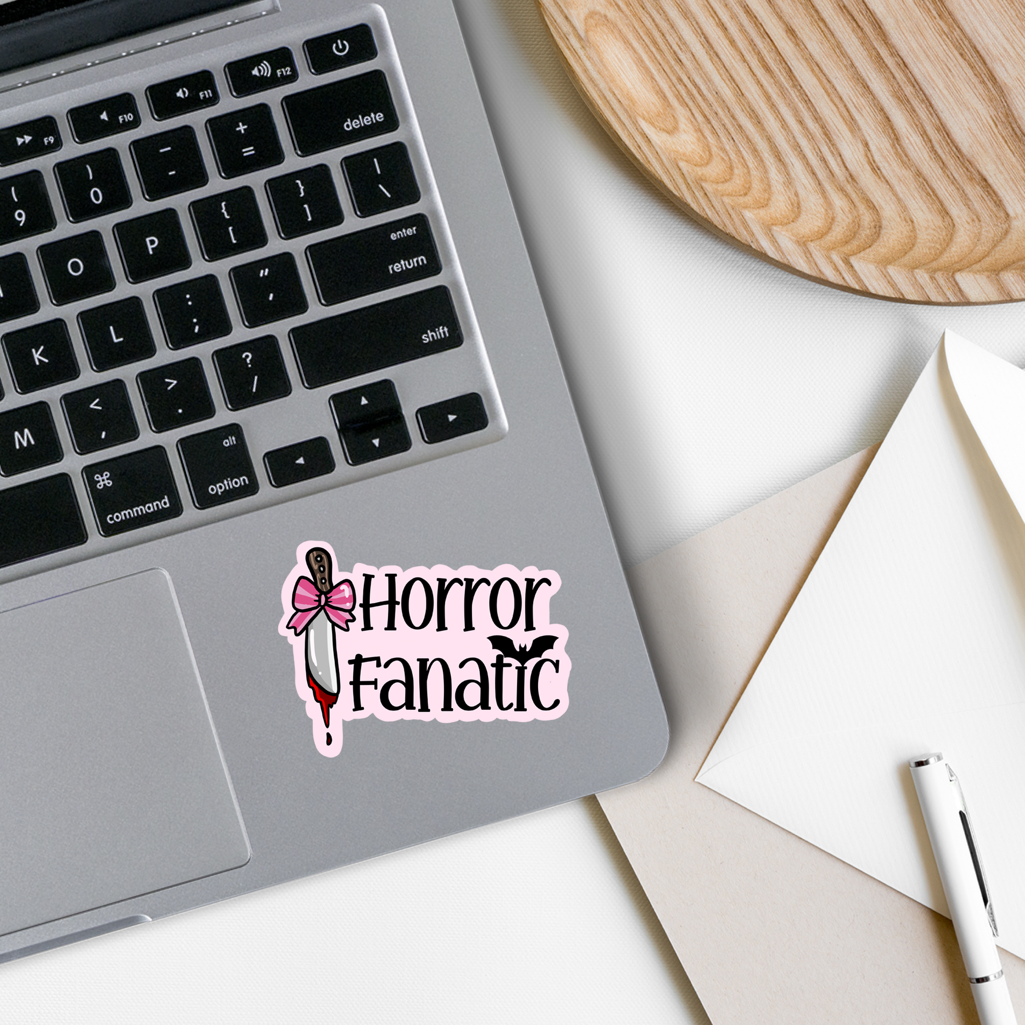 A vibrant Horror Fanatic Vinyl Sticker featuring spooky designs, perfect for personalizing items like laptops and water bottles.