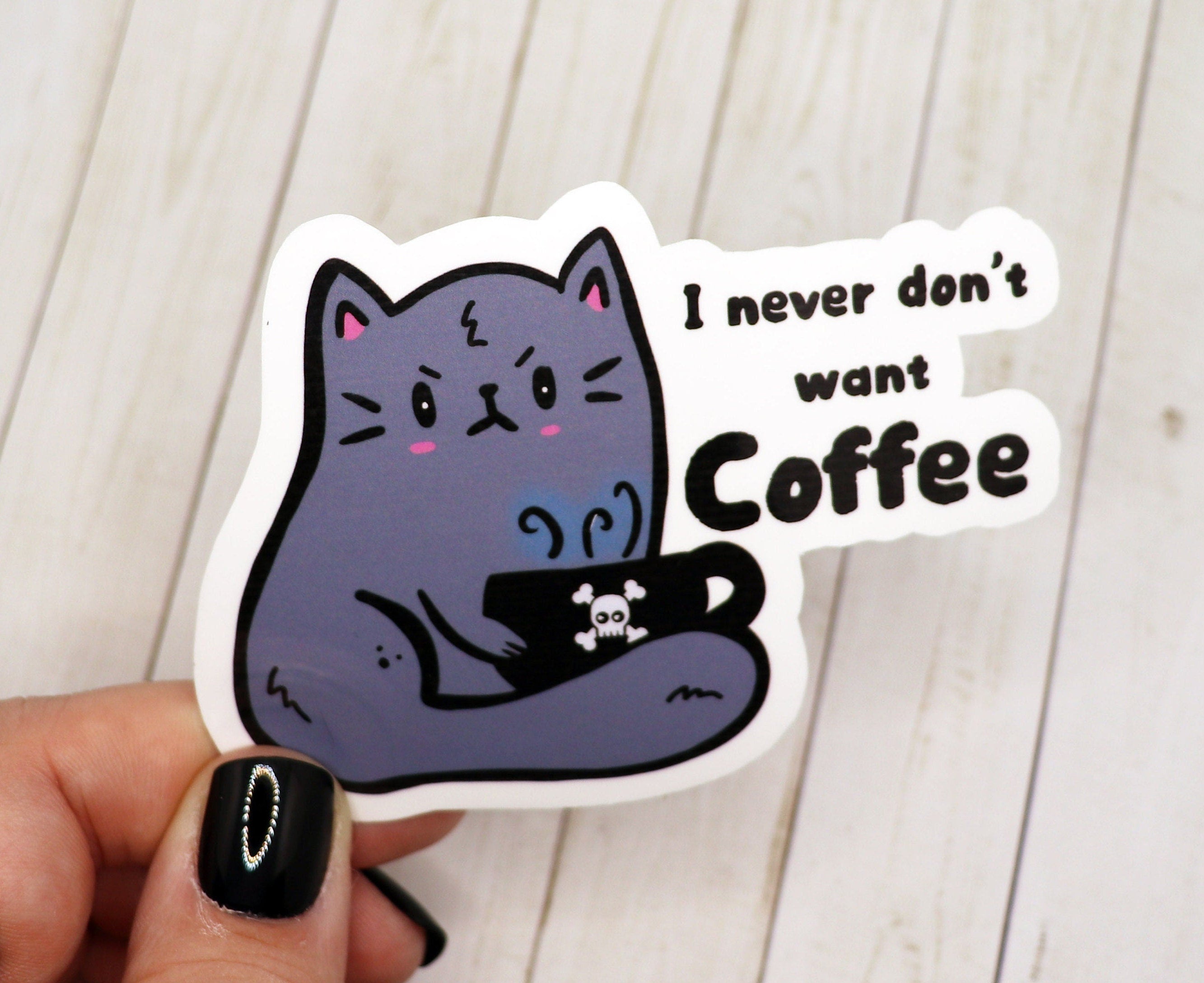 A cute vinyl sticker featuring a cat with the phrase 'I Never Don't Want Coffee', perfect for coffee lovers.