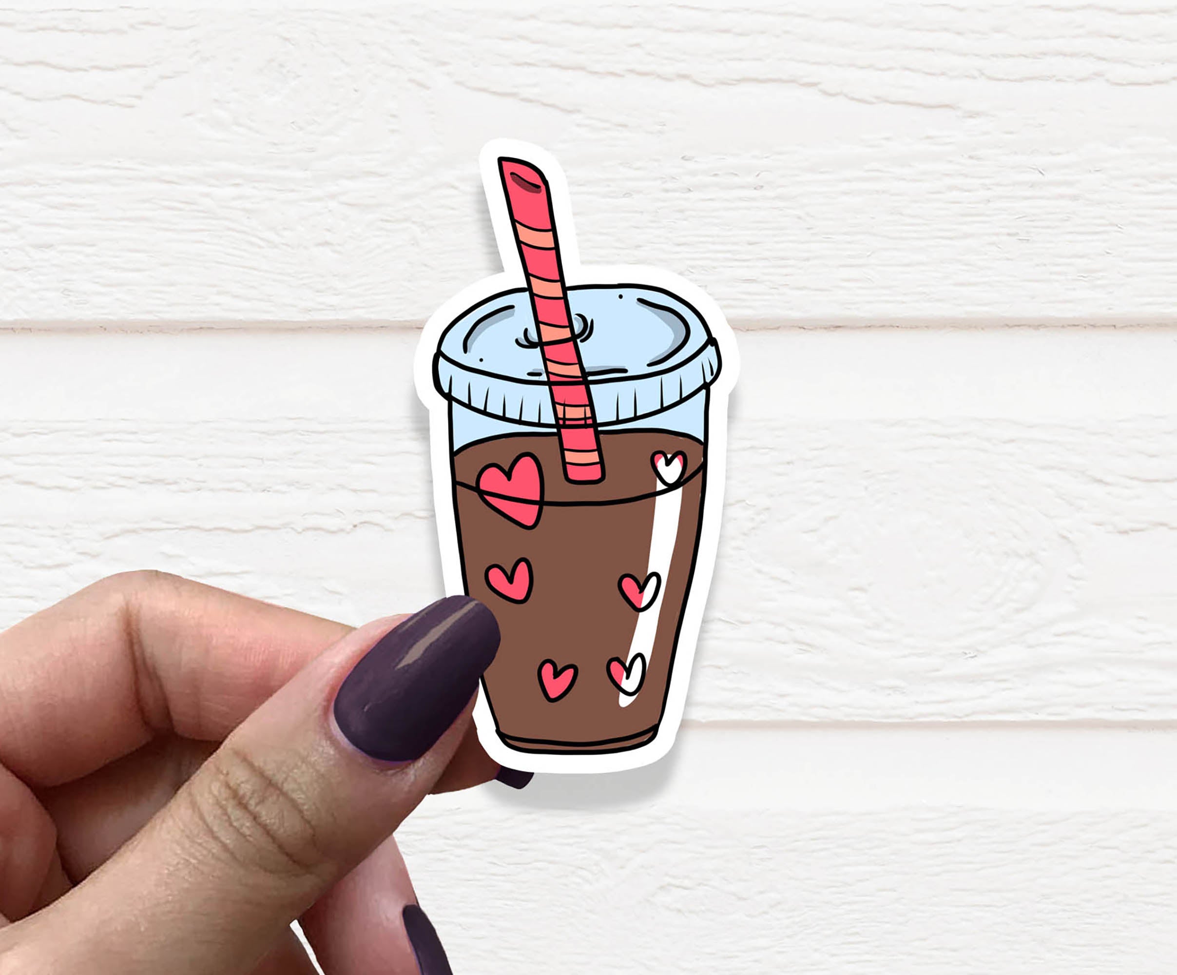 A vibrant Iced Coffee Vinyl Sticker featuring a stylish iced coffee design on matte vinyl, perfect for personalizing various items.