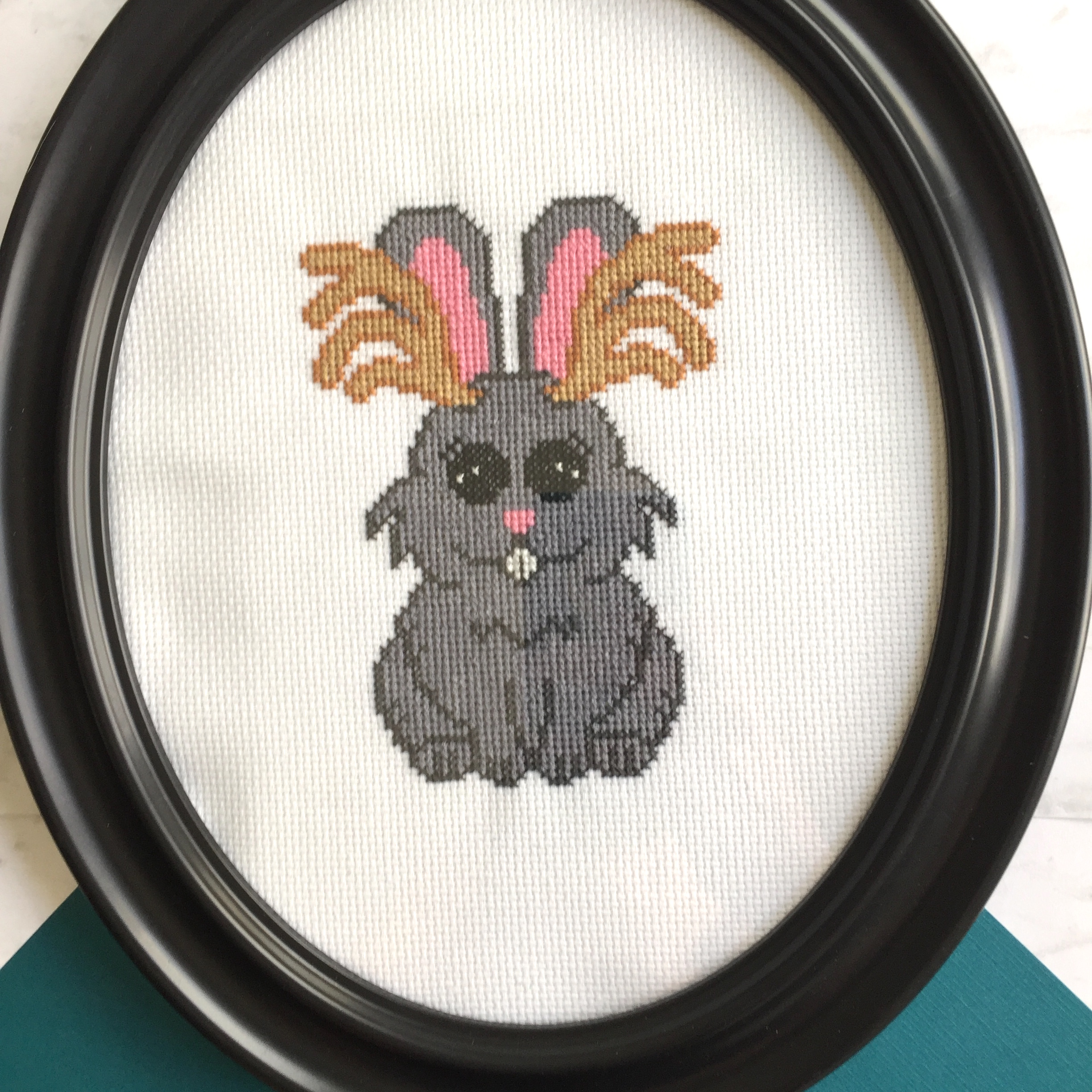 Jackalope Counted Cross Stitch DIY Kit featuring a whimsical design with all necessary supplies including fabric, threads, and a hoop.