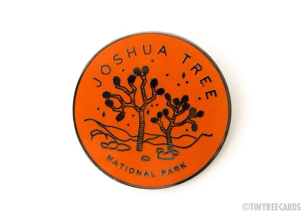 Joshua Tree National Park enamel pin featuring a detailed illustration of a Joshua Tree with text.