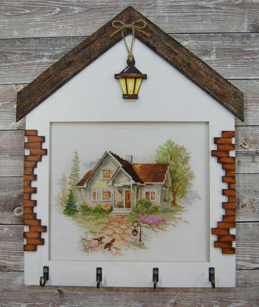 July House 3-20 Counted Cross-Stitch Kit featuring white Aida fabric, colorful threads, and an embroidery needle.