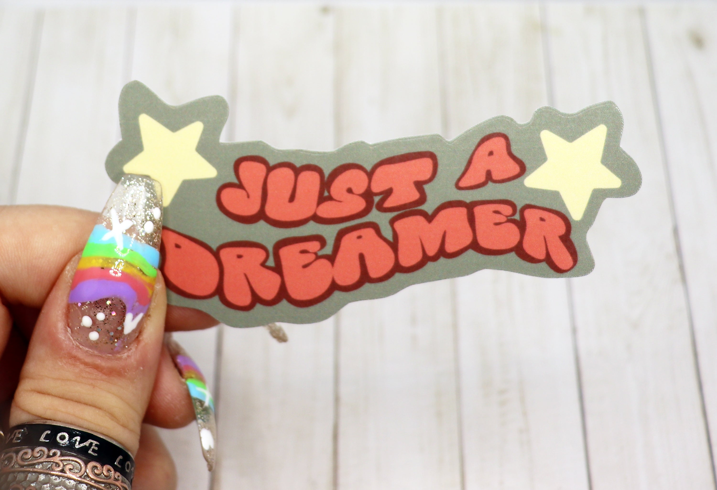 Just a Dreamer Vinyl Sticker featuring a dreamy design, perfect for personalizing various items.