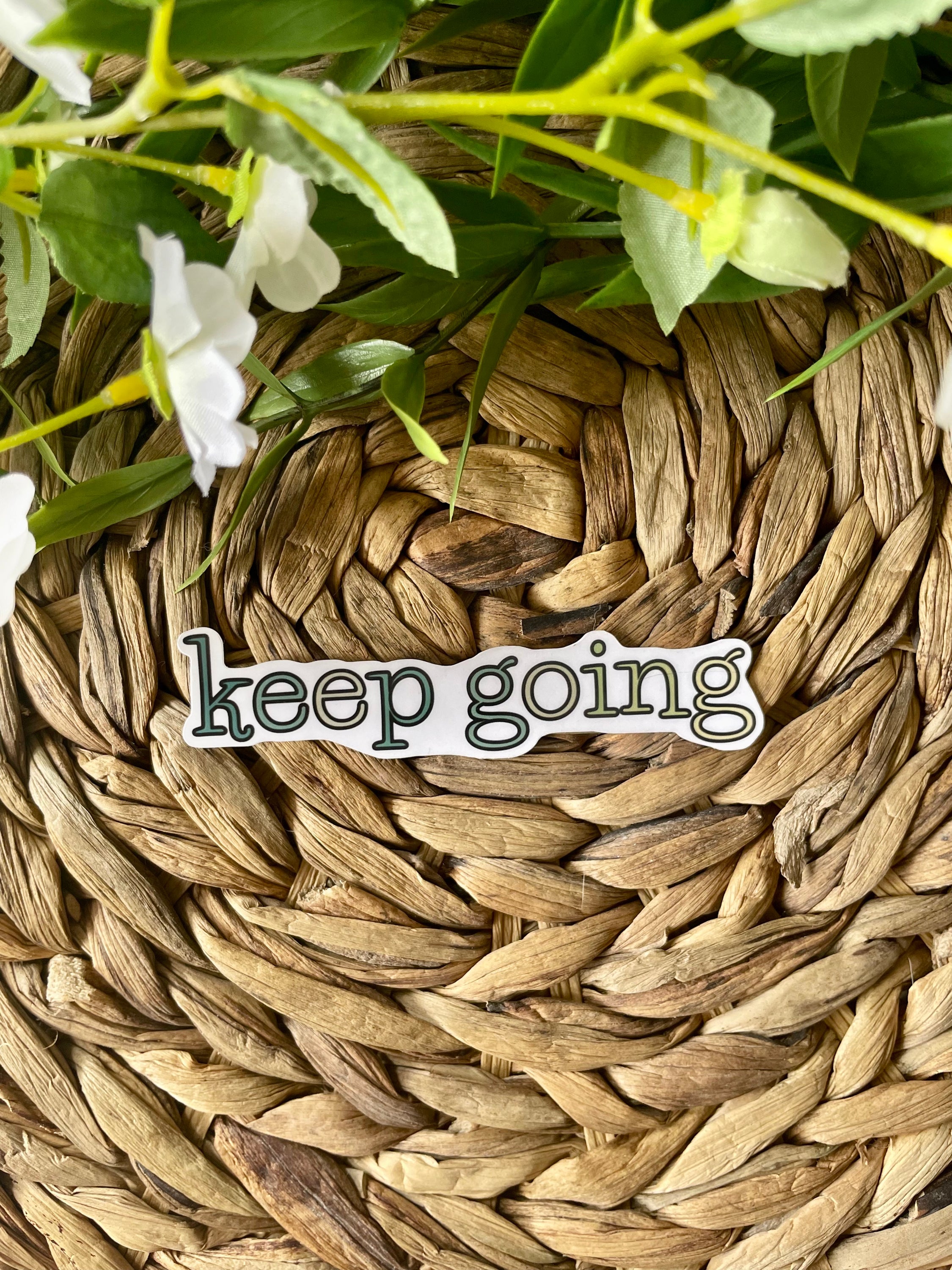 A cute aesthetic Keep Going sticker featuring a motivational design, perfect for personalizing laptops and water bottles.