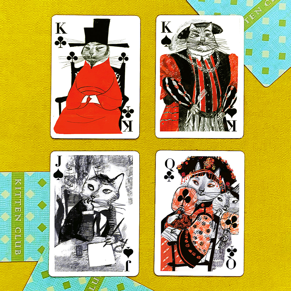 Playing cards featuring dressed-up cats.