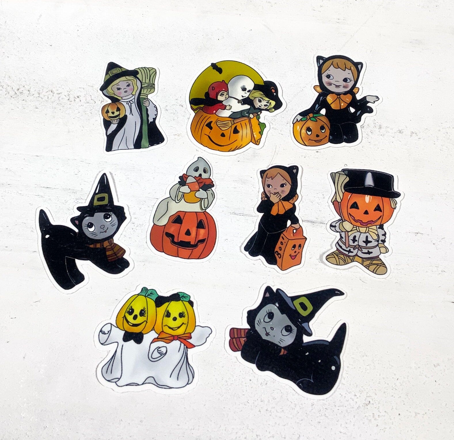 A colorful assortment of 9 kitsch Halloween stickers featuring spooky designs, printed on high-quality matte vinyl.