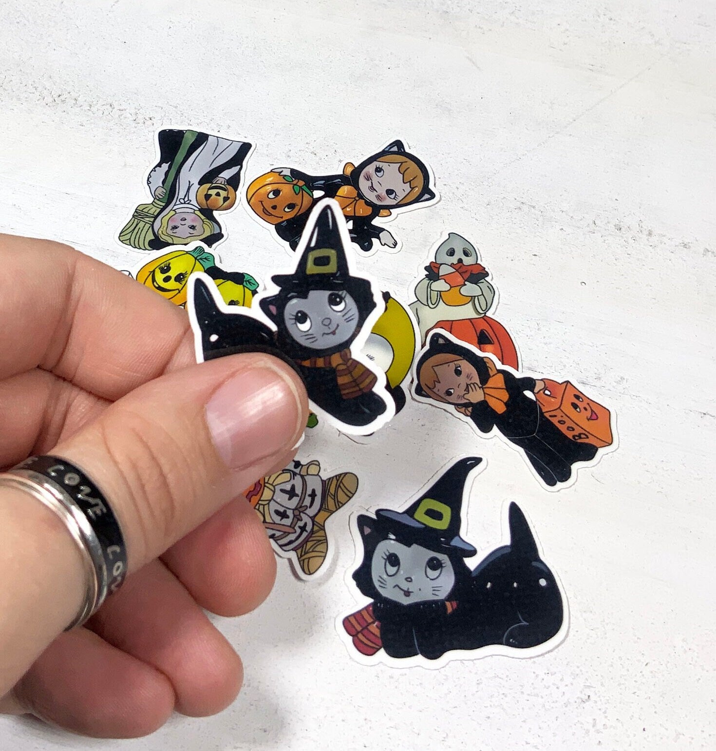 A colorful assortment of 9 kitsch Halloween stickers featuring spooky designs, printed on high-quality matte vinyl.