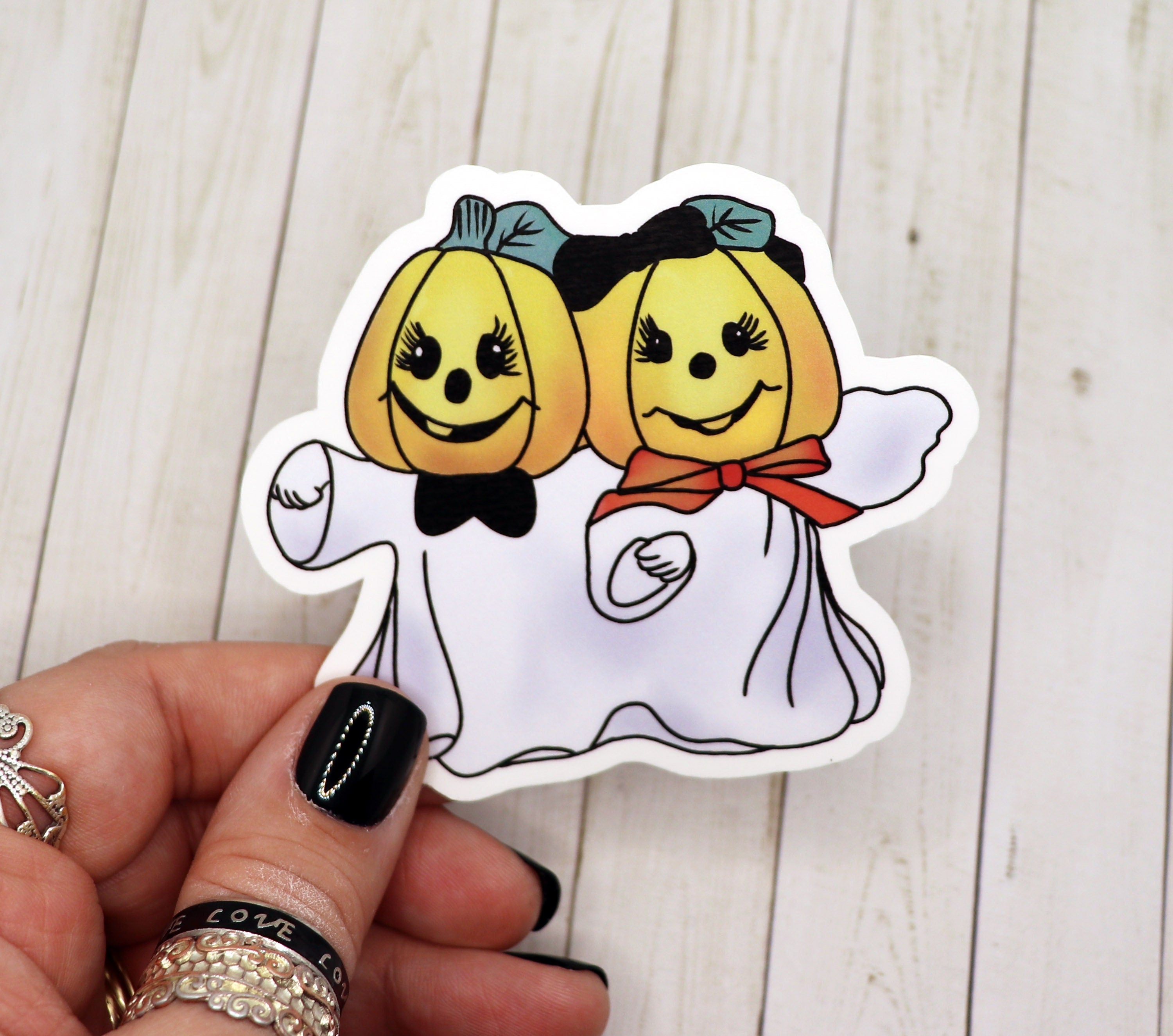 A vibrant Kitsch Pumpkin Sticker featuring a whimsical pumpkin design on high-quality matte vinyl.