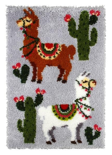 Latch hook rug kit featuring alpacas design with yarn and tools included.