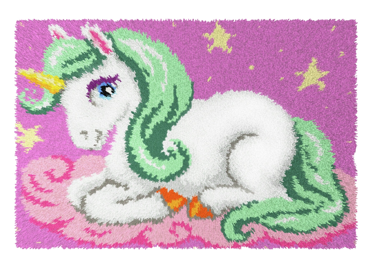 A colorful latch-hook carpet kit featuring a unicorn design on printed Zweigart canvas, with pre-cut acrylic yarn and a latch-hook tool.