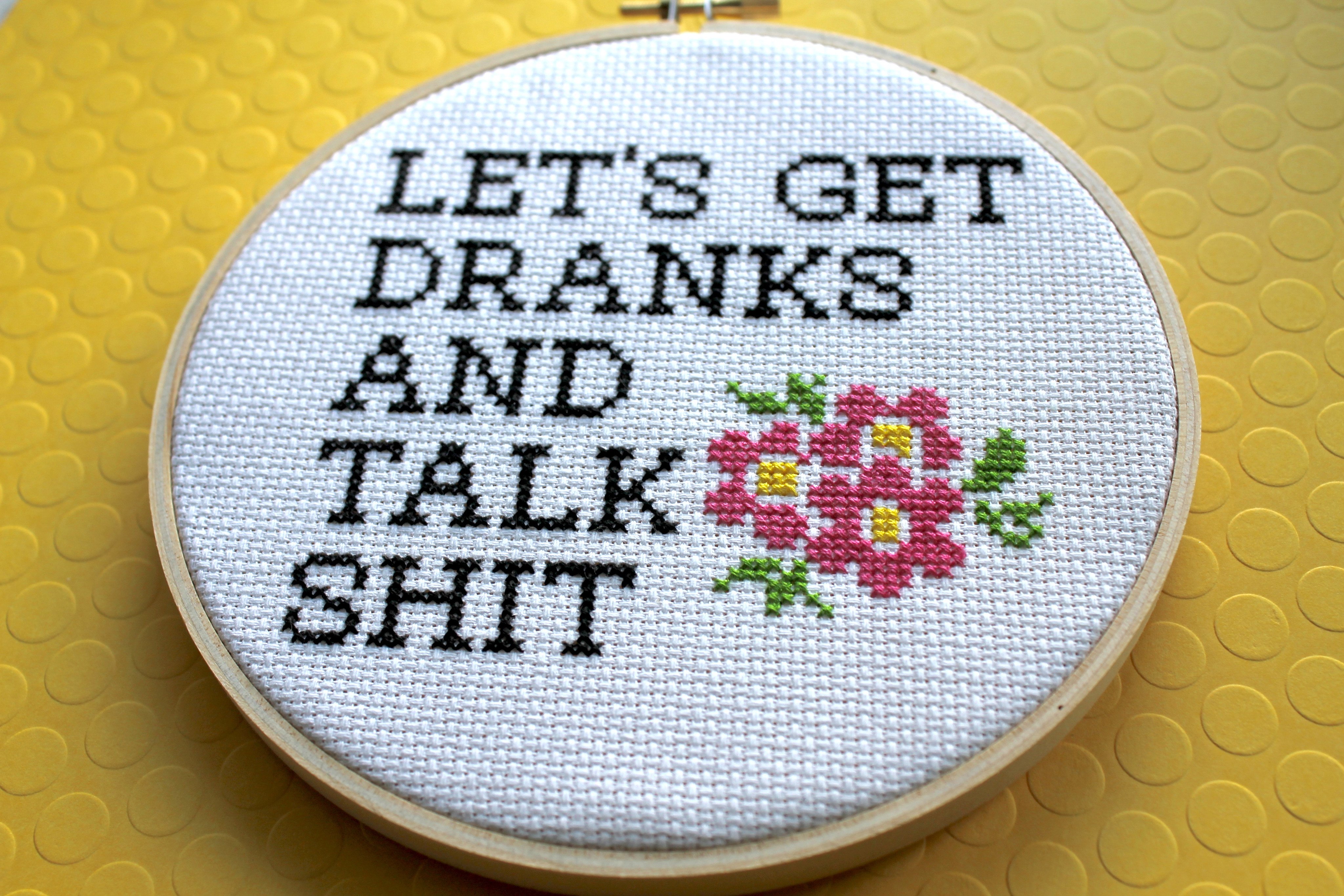 Let's Get Dranks and Talk Sh*t Counted Cross Stitch DIY Kit featuring floral elements and humorous text.