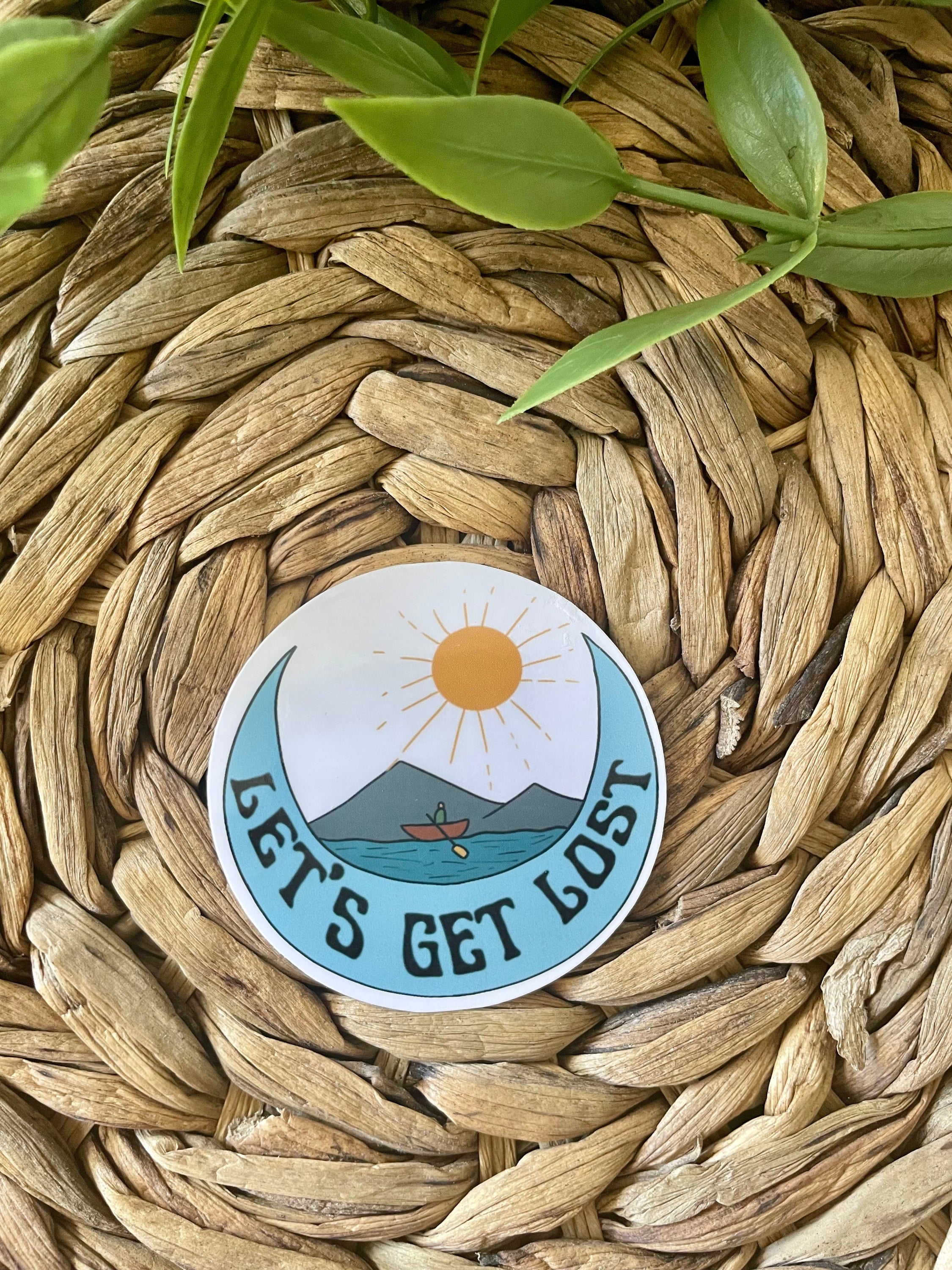 A vibrant 'Let's Get Lost' sticker featuring adventurous design, perfect for personalizing hydroflasks and laptops.