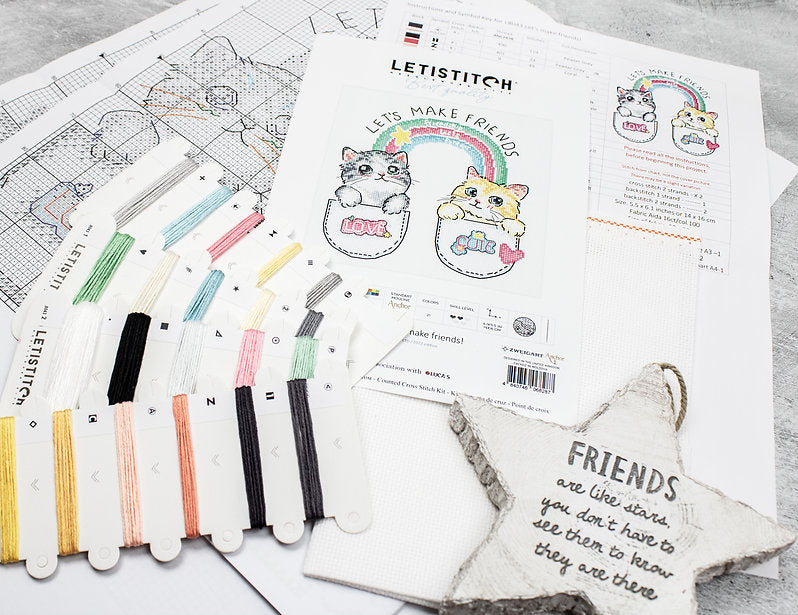 Let's Make Friends! L8043 Counted Cross Stitch Kit featuring colorful threads, canvas, and instruction chart.