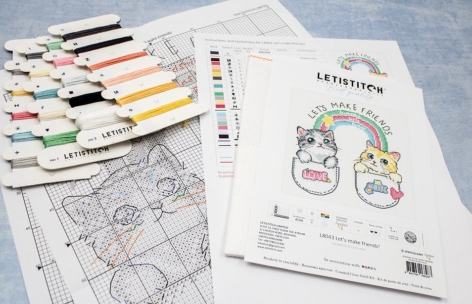 Let's Make Friends! L8043 Counted Cross Stitch Kit featuring colorful threads, canvas, and instruction chart.