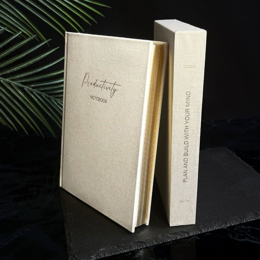 Linen Productivity Lined Notebook with gold edging and silk ribbon bookmark, displayed in a protective hardback sleeve.