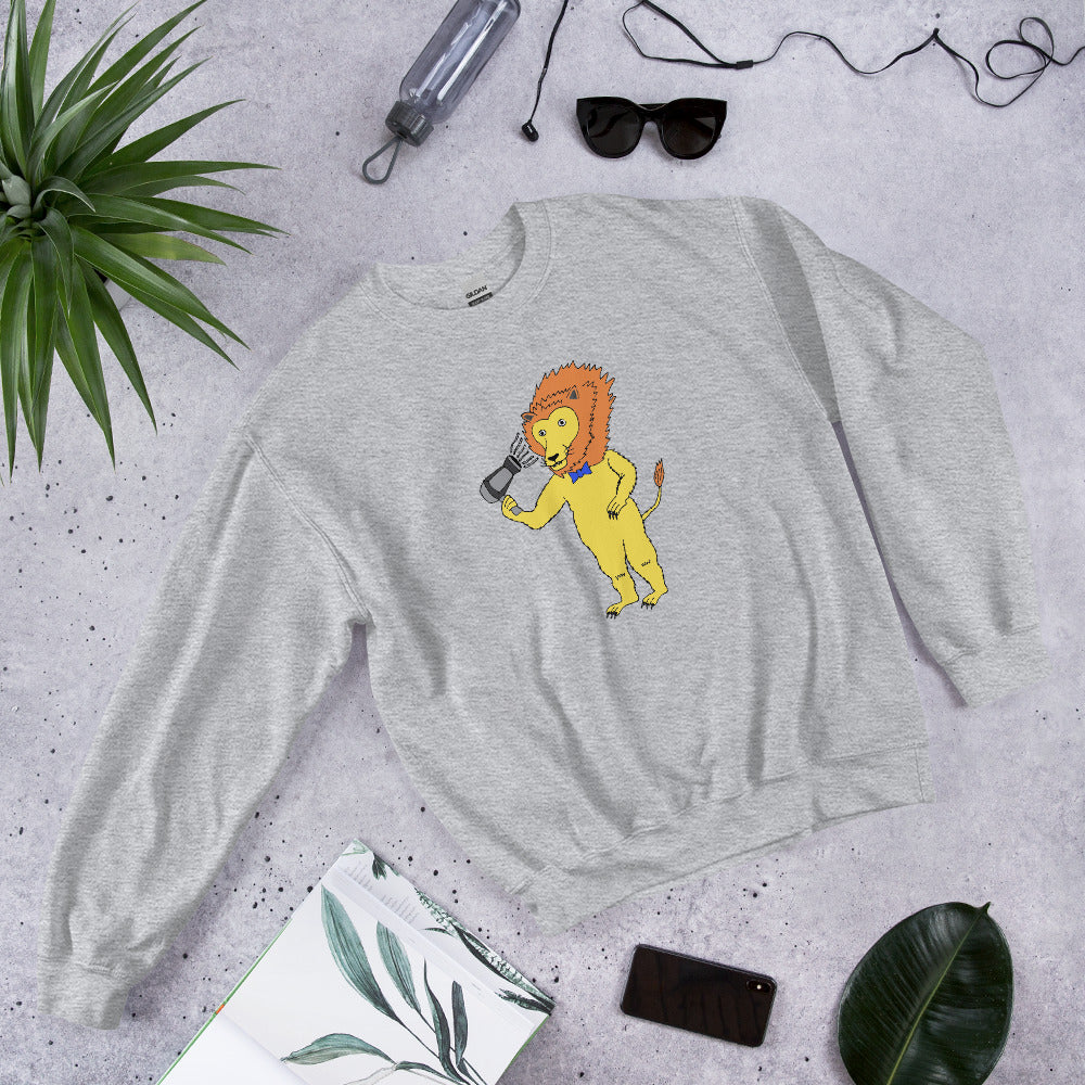 A unisex sweatshirt featuring a playful lion blow-drying its mane, showcasing a unique and humorous design.