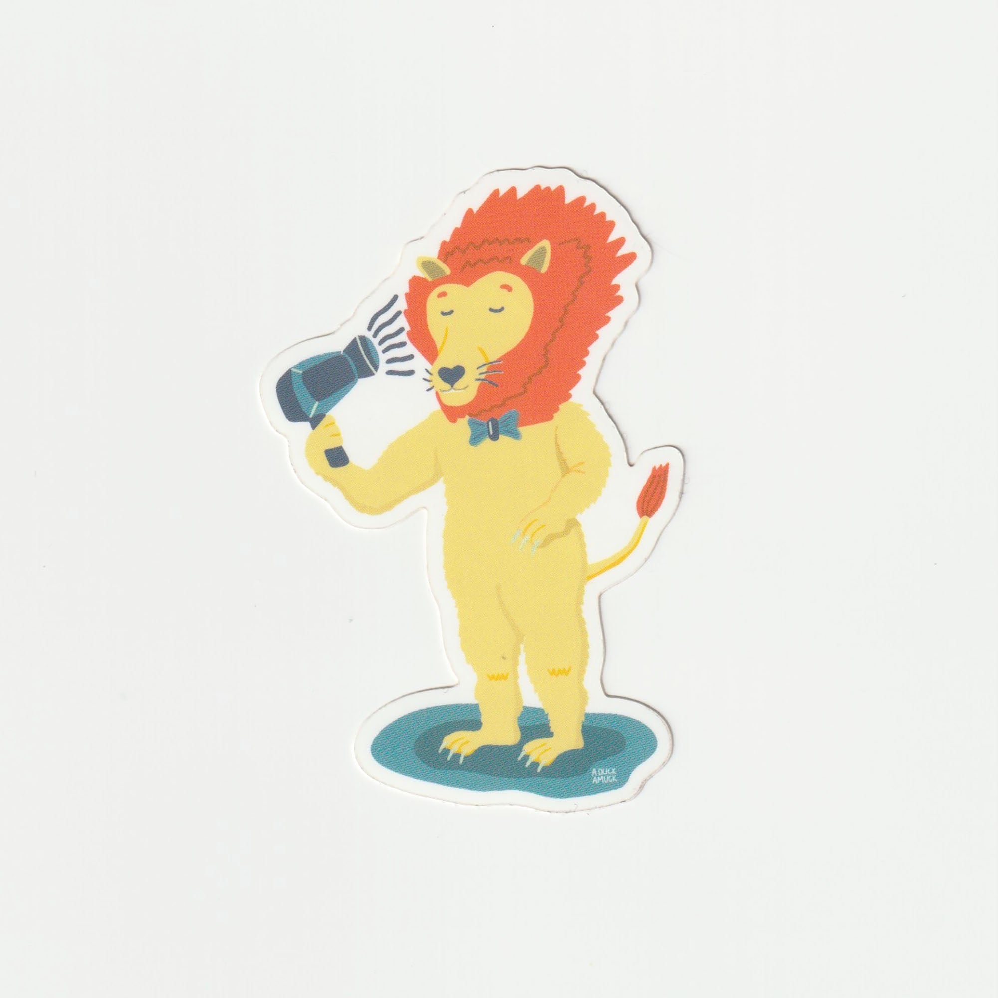 A colorful vinyl sticker featuring a lion blow-drying its mane, showcasing vibrant colors and a glossy finish.