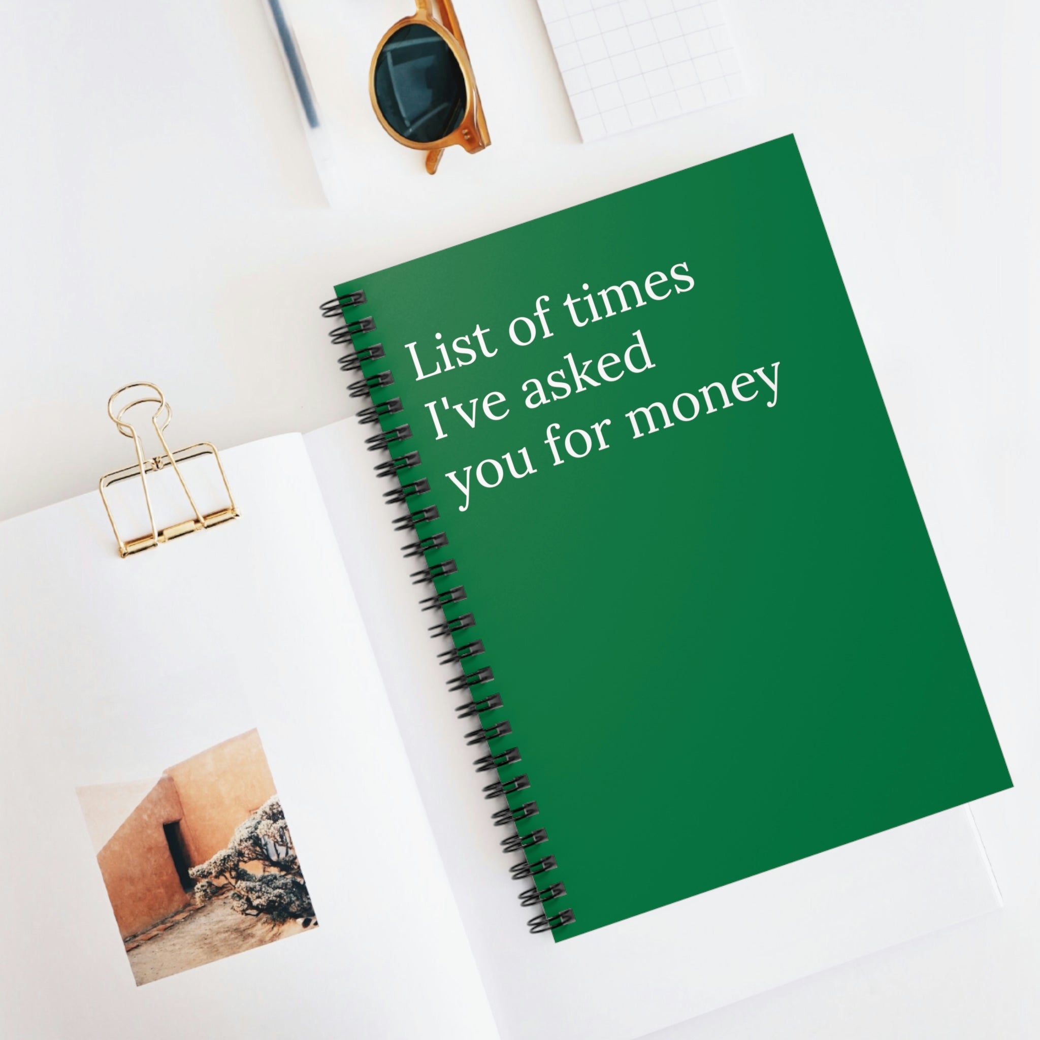 A humorous notebook titled 'List of Times I've Asked You For Money' featuring a spiral binding and ruled line pages, perfect for jotting down thoughts.