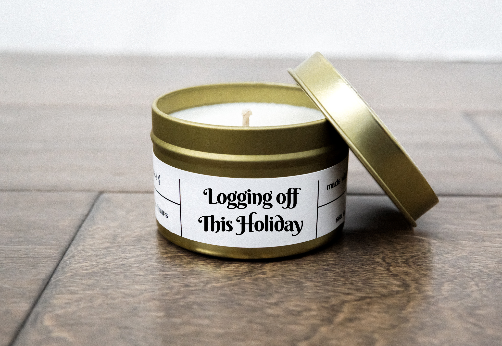 Logging Off This Christmas candle in a 4oz jar, featuring a rustic design and a warm, inviting fragrance blend of smoked woods and peppercorn.