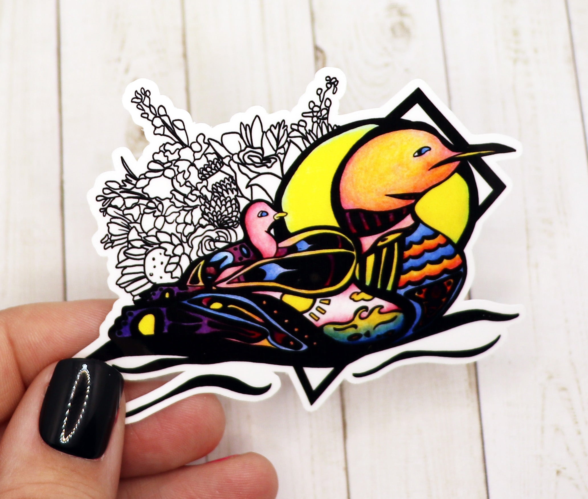 A vibrant Loon Sticker on a matte vinyl surface, showcasing its colorful design and durable finish.