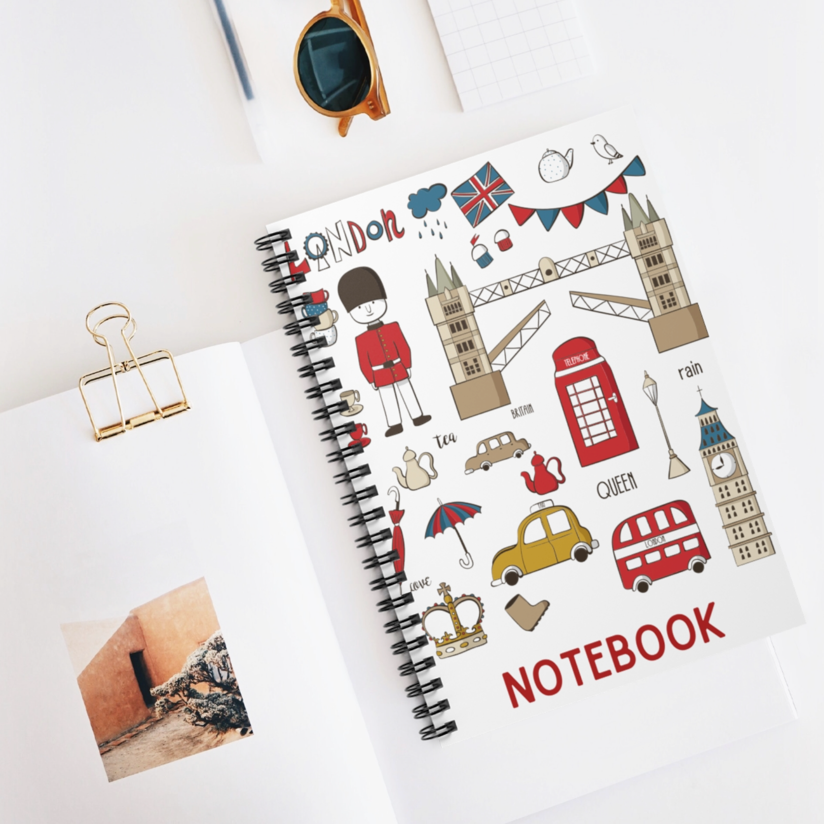 A stylish A5 lined notebook with black spiral binding, featuring 100 pages for writing and sketching.