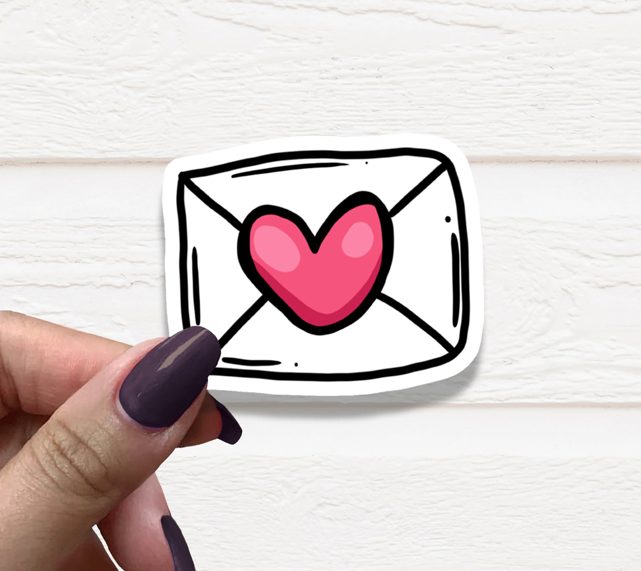 A vibrant Love Envelope Vinyl Sticker featuring a heart design, perfect for personalizing various items.