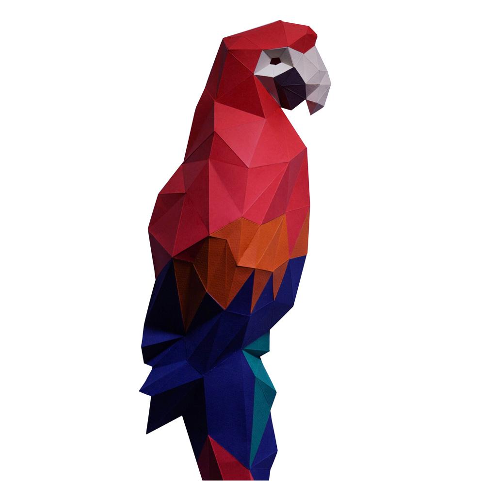 Colorful 3D Macaw Wall Art made from paper, showcasing vibrant feathers and a large beak, mounted as if perched on a branch.