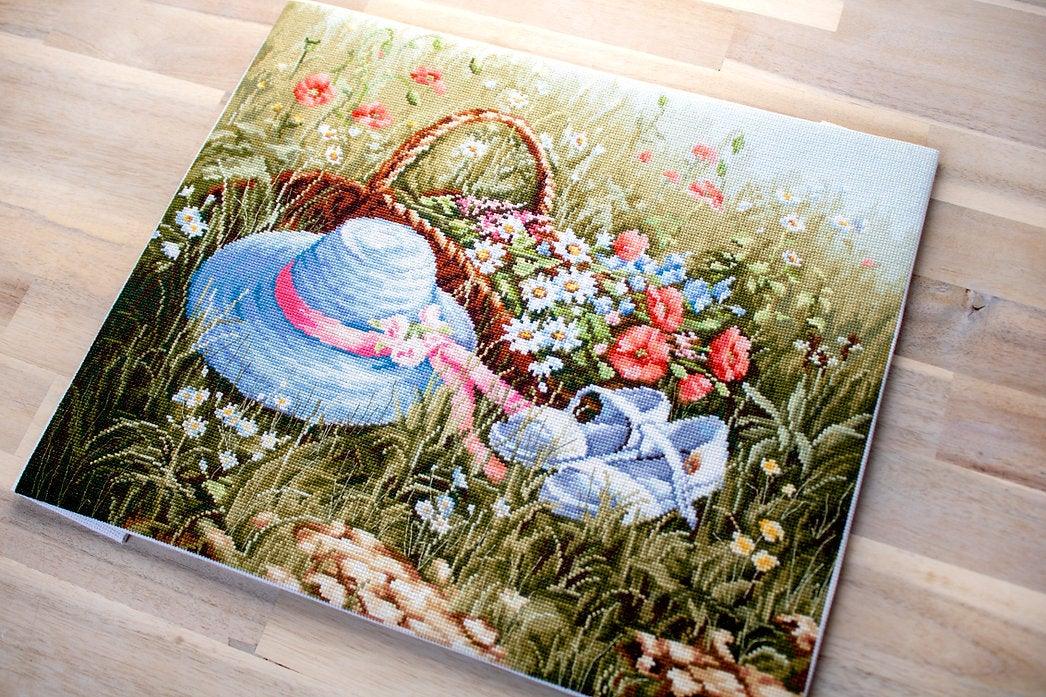 Meadow with Poppies BU4020L Counted Cross-Stitch Kit featuring vibrant flowers and blue hat on high-quality canvas.