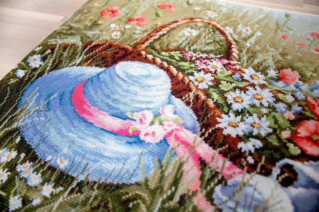 Meadow with Poppies BU4020L Counted Cross-Stitch Kit featuring vibrant flowers and blue hat on high-quality canvas.