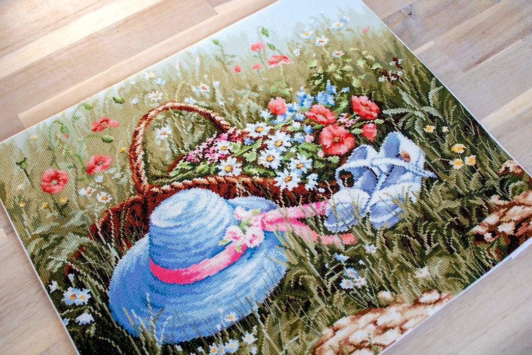 Meadow with Poppies BU4020L Counted Cross-Stitch Kit featuring vibrant flowers and blue hat on high-quality canvas.