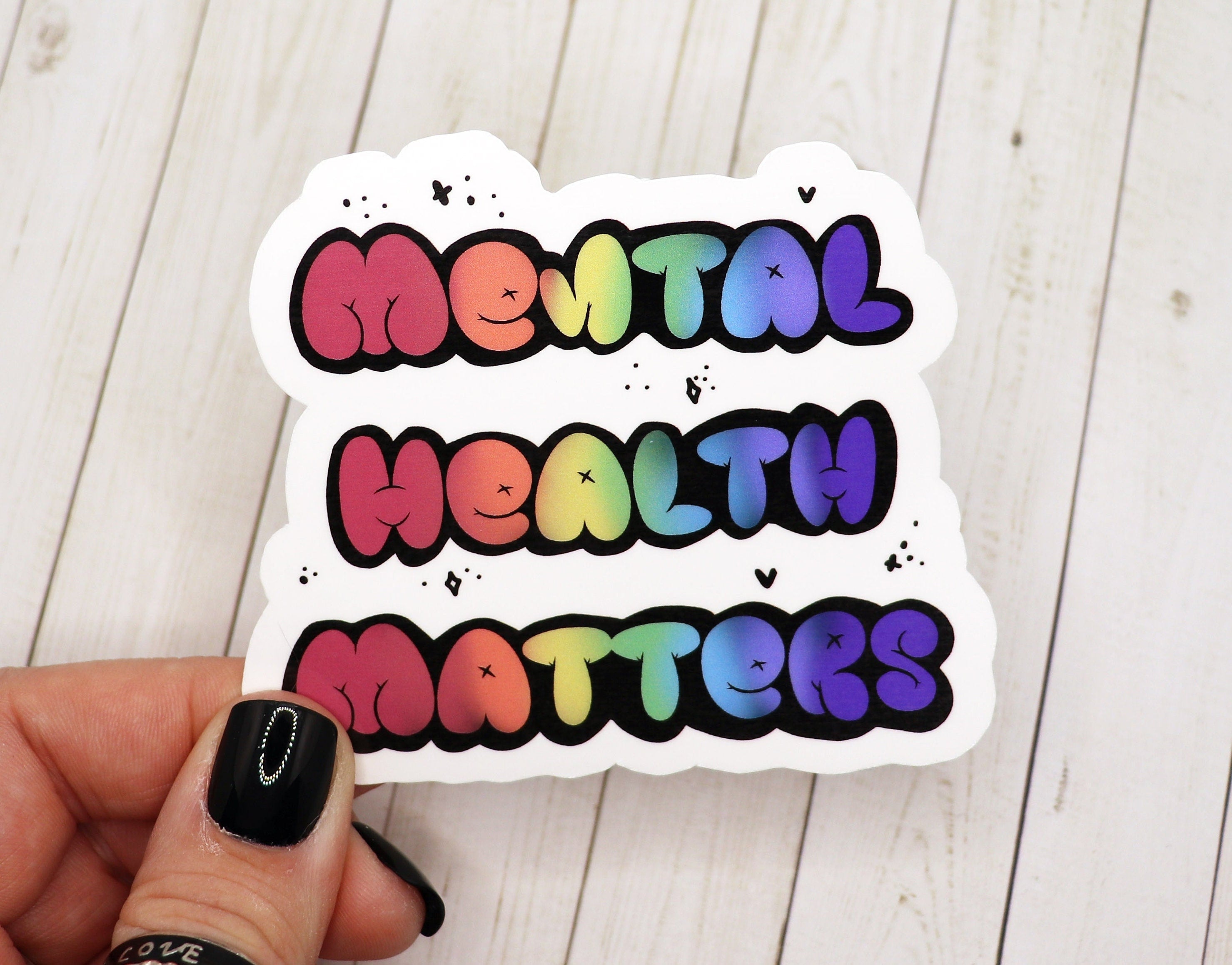 Mental Health Matters vinyl sticker on a white background, showcasing its vibrant design and matte finish.