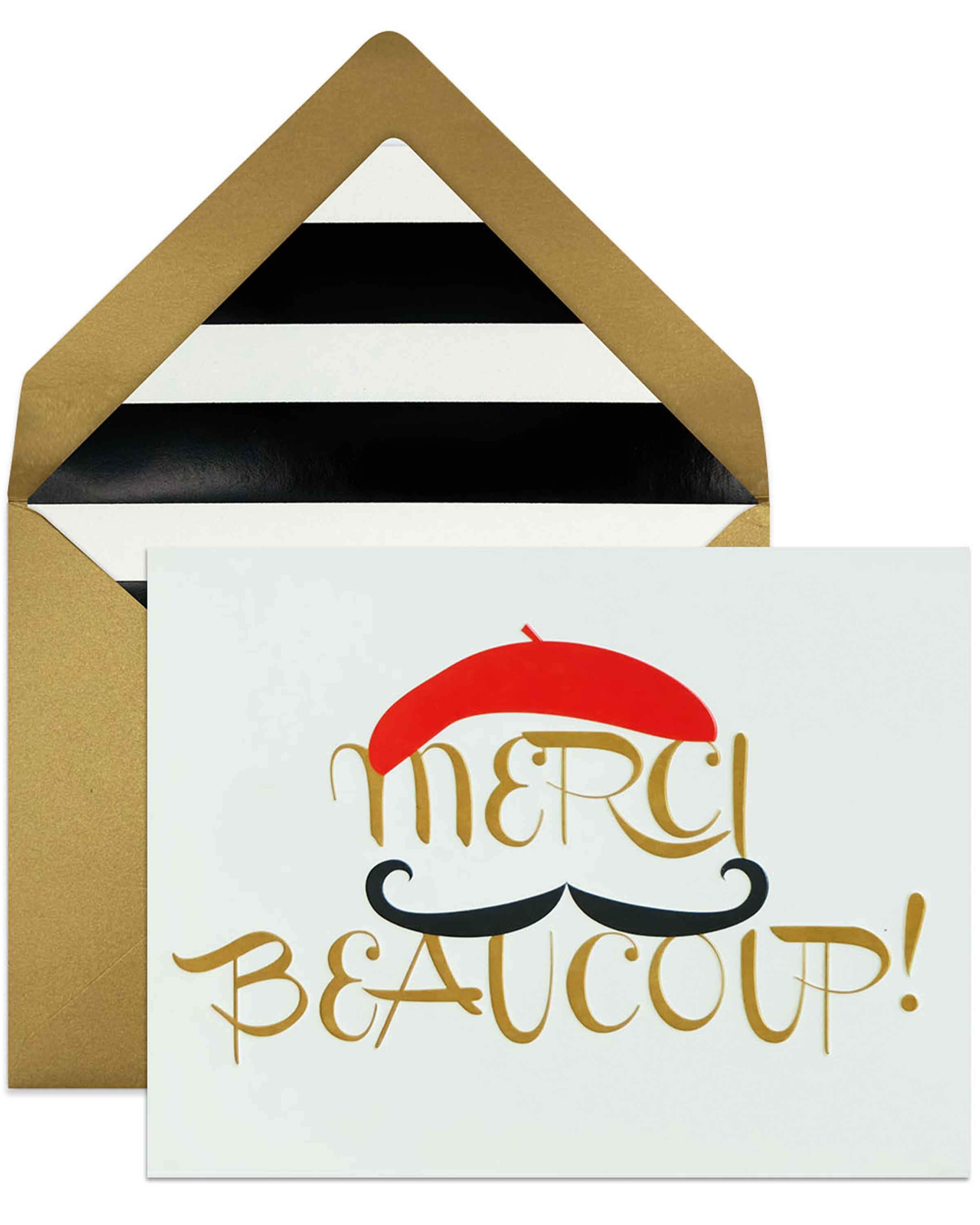 A stylish 'Merci Beaucoup' thank you card with a lined envelope, featuring debossed finishing and elegant design.