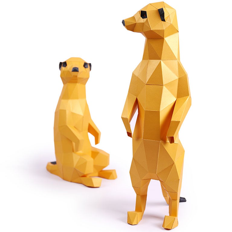 Two charming 3D paper meerkat models, one standing and one seated, showcasing intricate details and vibrant colors.