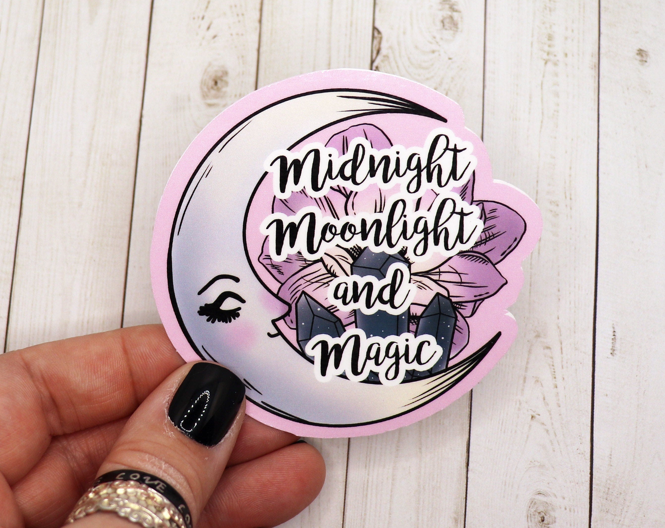 Midnight Moonlight and Magic Sticker featuring a celestial design with stars and a moon on a matte vinyl surface.