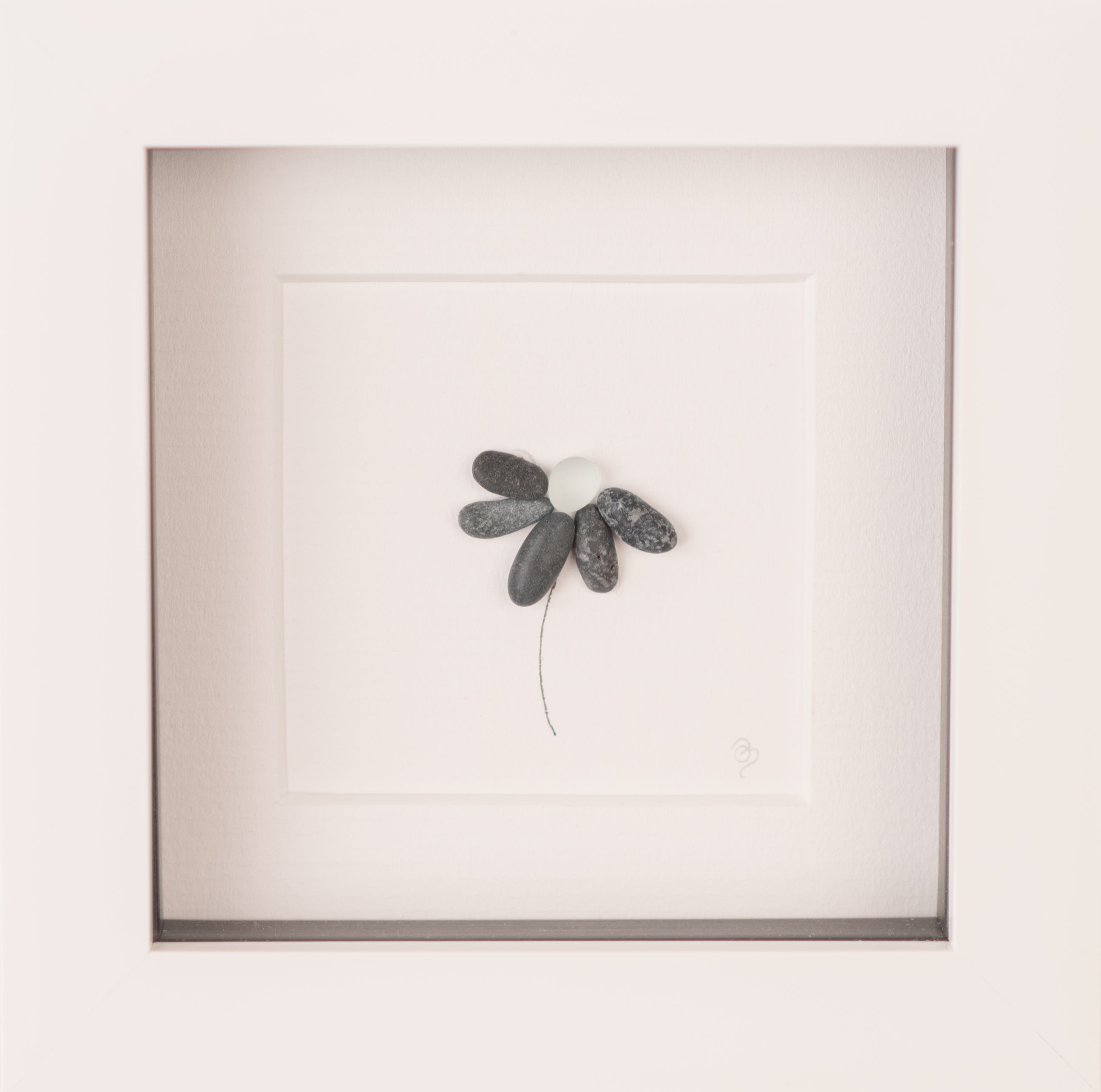 A delicate Mini Flowers art piece framed in white, showcasing unique floral designs inspired by nature.