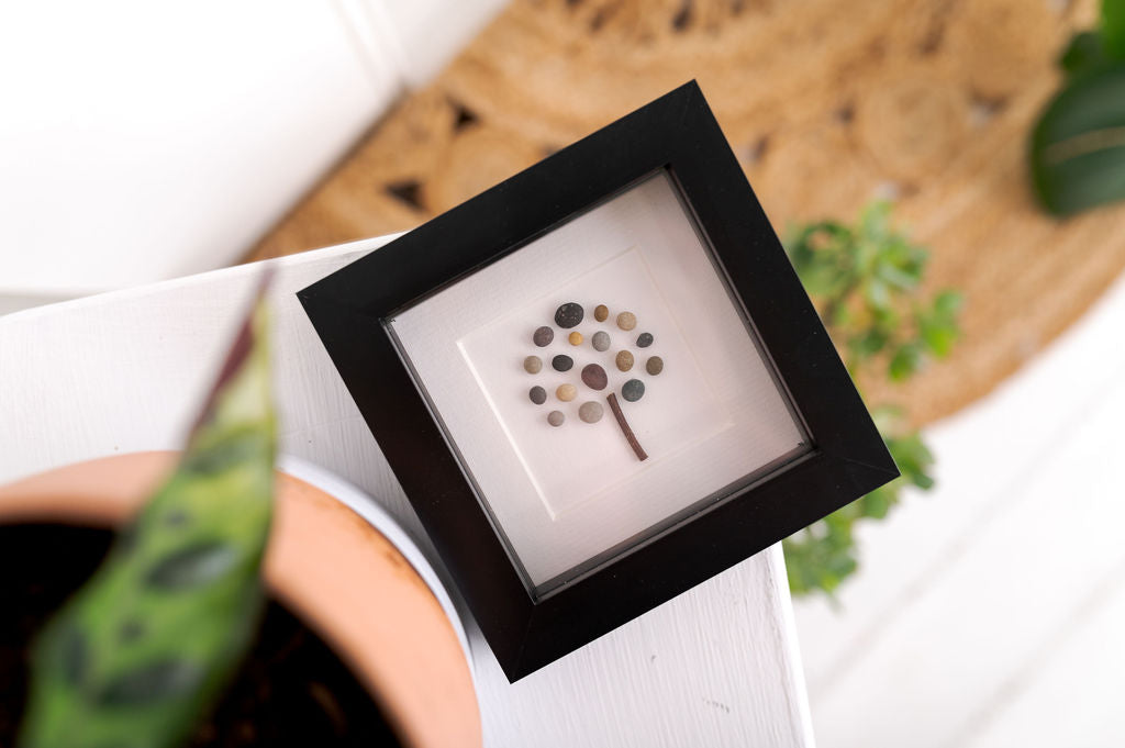 A beautifully crafted Mini Tree of Life art piece featuring vibrant colors and natural materials, framed in a sleek black frame.