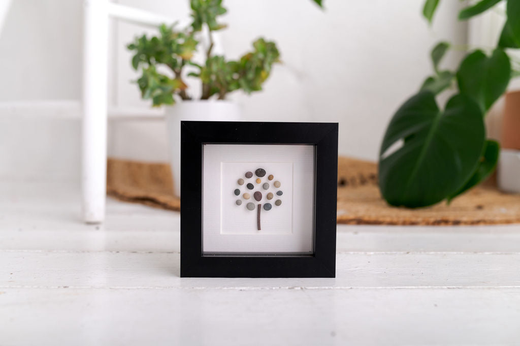 A beautifully crafted Mini Tree of Life art piece featuring vibrant colors and natural materials, framed in a sleek black frame.