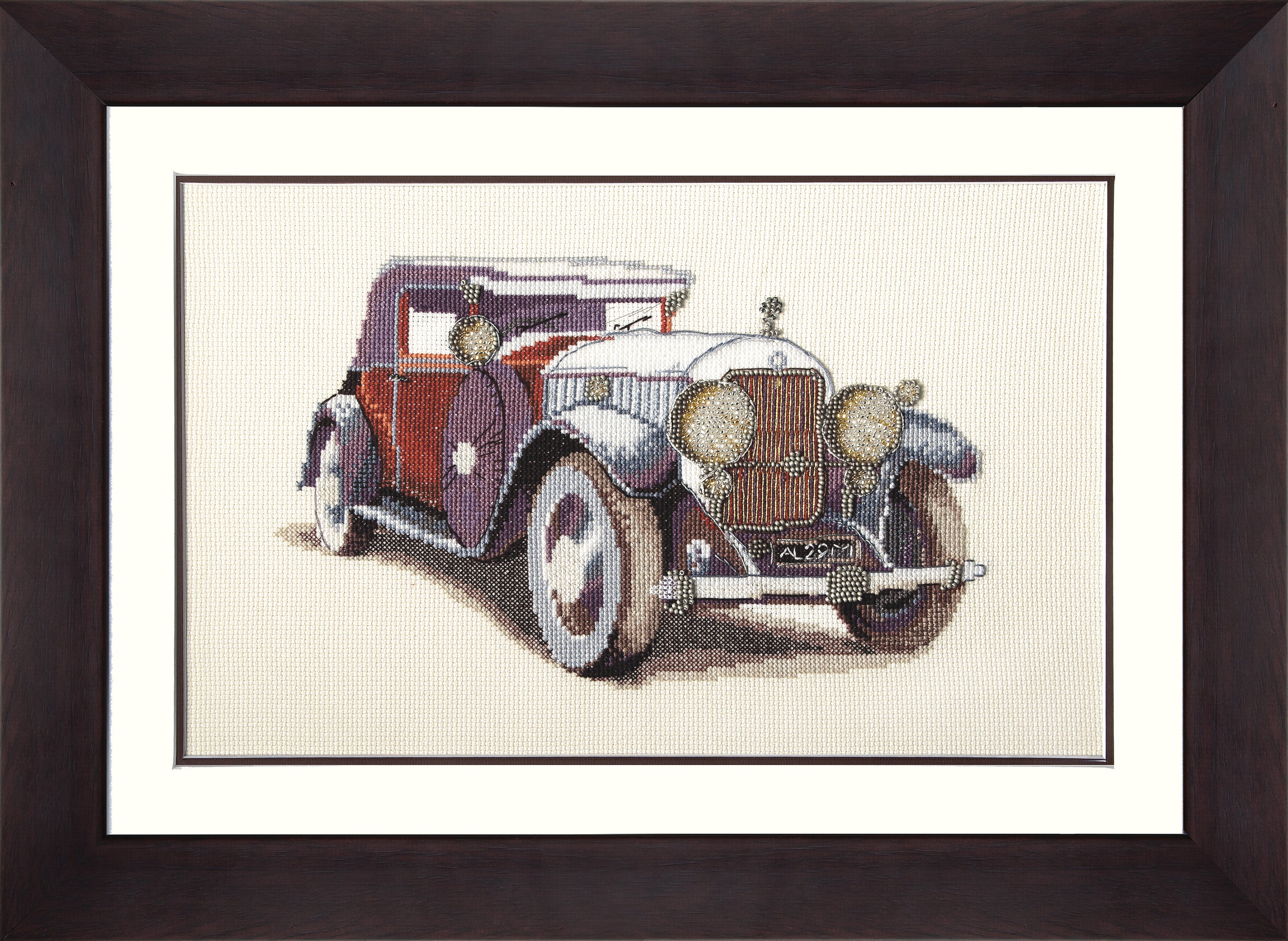 Mixed technique stitch kit featuring Auto Skoda 1933 with colorful threads and beads, perfect for cross stitch enthusiasts.