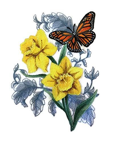 Embroidered patch featuring a Monarch Butterfly and daffodils, showcasing vibrant colors and intricate details, perfect for sewing or ironing on garments.