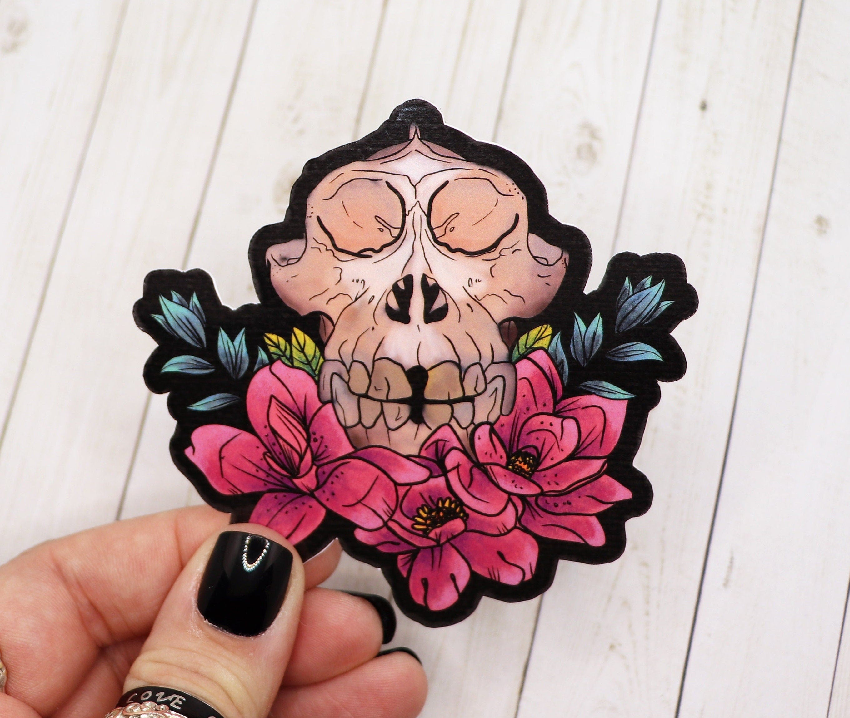 A detailed Monkey Skull Sticker featuring a stylized skull design, perfect for personalizing various items.