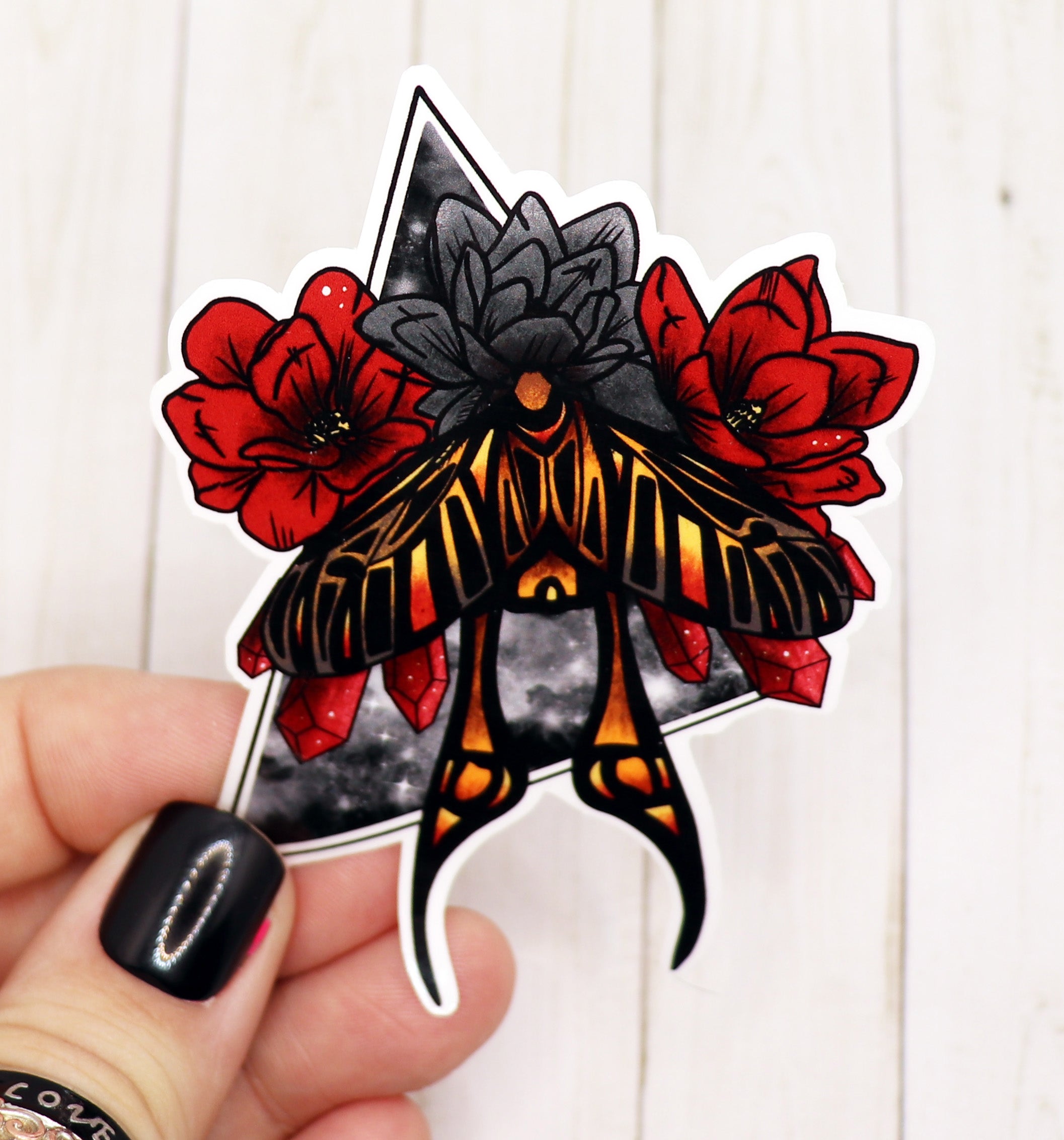 A beautifully designed Moth Sticker on a matte vinyl surface, showcasing intricate details and vibrant colors.