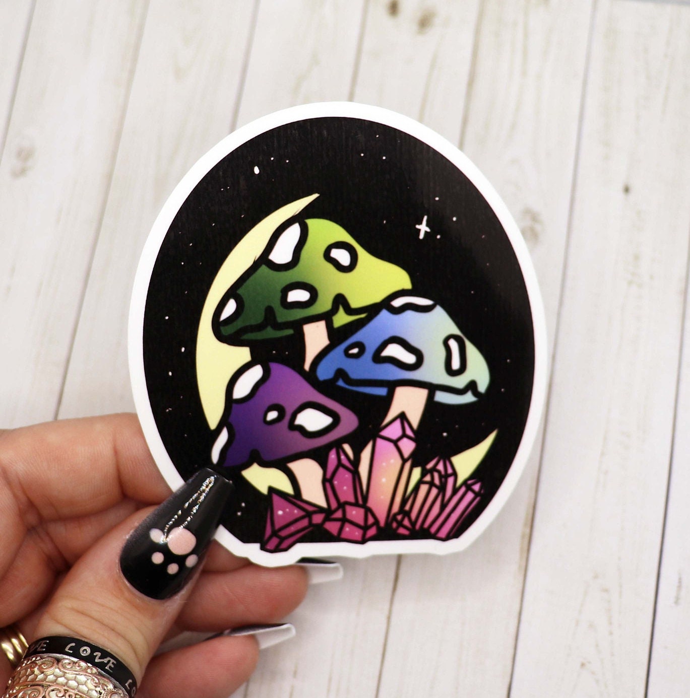 A vibrant Mushroom and Moon Sticker featuring colorful mushrooms and a crescent moon design on a matte background.