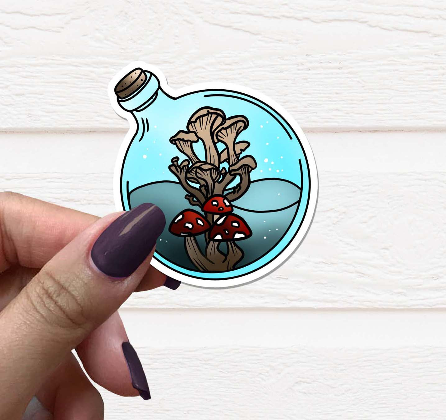 A vibrant Mushroom Potion Bottle Vinyl Sticker on a white background, showcasing intricate details and colors.